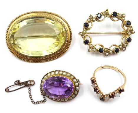 Edwardian amethyst and seed pearl brooch stamped 9ct,a sapphire and seed pearl brooch, an opal and garnet wishbone ring both 