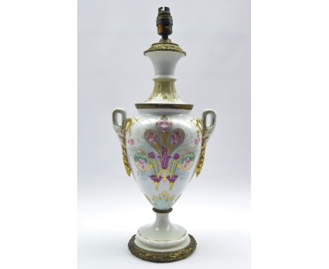 19th century Continental two-handled urn shaped porcelain oil lamp, hand painted with floral sprays with gilt metal stand, H4