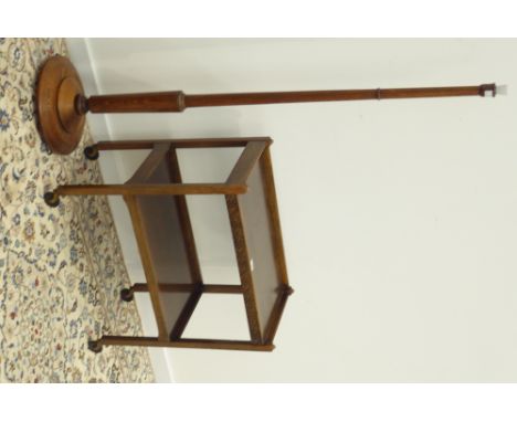 20th century oak two tier tea trolley with blind fret work decoration (W69cm, H76cm, D39cm), and an oak standard lamp