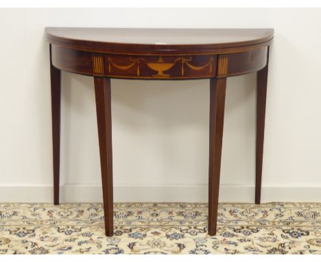 Early 19th century mahogany demi-lune card table, fold over top with baize lining, frieze inlaid with urn and swags, square t