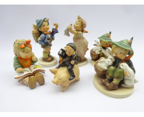 Six Goebel figures; Wash Day no. 321, Chimney Sweep Boy Riding on Pig, Bookworm no. 8 and three others (6)