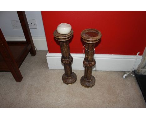 A pair of candlestick wood effect (with some heat damage) 