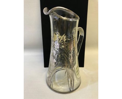 Sterling silver overlay water jug depicting floral design. Stands 28cm in height. 