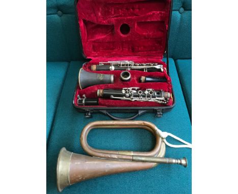 Corton Clarinet with a fitted case together with copper and brass bugle. 