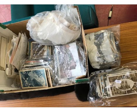 Approximately 600 vintage postcards & a bag of loose stamps 