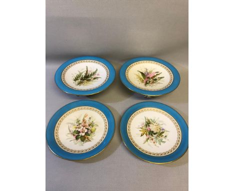 Four Royal Worcester cabinet plates and tazza's dated 1888, Hand painted floral designs and light blue and guild edgings 