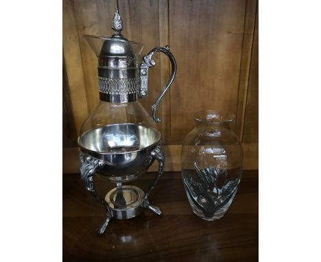 Silver plated & glass red wine jug styled on a 3 foot supporting stand, together with a glass & pewter floral design vase 