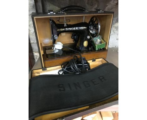 Vintage Electric singer sewing machine, comes with a fitted carry case. 