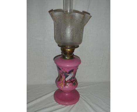 A Victorian pink opaque glass floral decorated oil lamp with detachable reservoir and etched glass shade (small hairline crac
