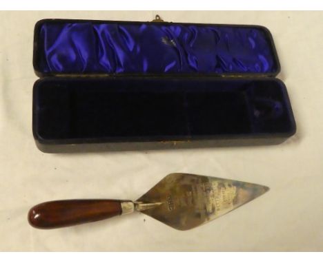 A silver plated presentation trowel "This trowel was used by Miss Ellis to lay the first brick of the new Elephant &amp; Cast