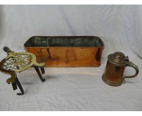 A Victorian brass trivet with pierced decoration and turned handle, copper rectangular plant holder and a copper pint-size ta