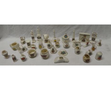 A selection of approximately thirty-five various china crested souvenir pieces including Nurse Cavell statue and figure, Newq