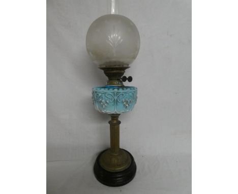 A Victorian brass oil lamp with fluted stem, blue tinted opaque glass floral reservoir and etched glass shade (stem requiring