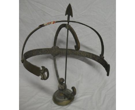 A brass armillary sundial with curved calibrated scale 22 ½" high