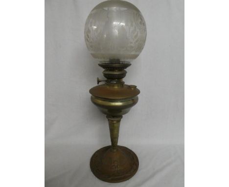 An Edwardian brass and copper Art Nouveau-style pedestal oil lamp with etched glass shade
