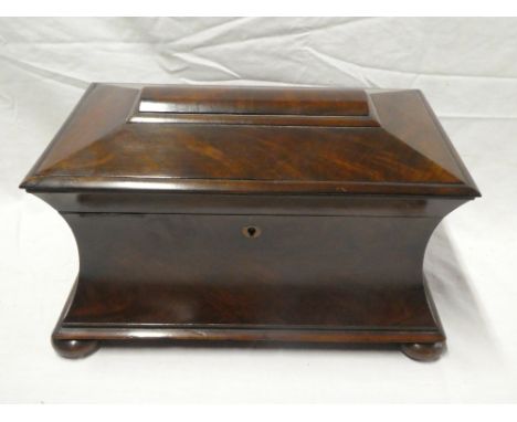 A Victorian figured mahogany sarcophagus-shaped tea caddy with twin caddies and glass mixing bowl enclosed by a hinged lid 15