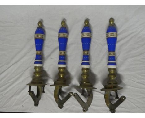 Four old brass and ceramic beer pump handles with floral decoration (one af)