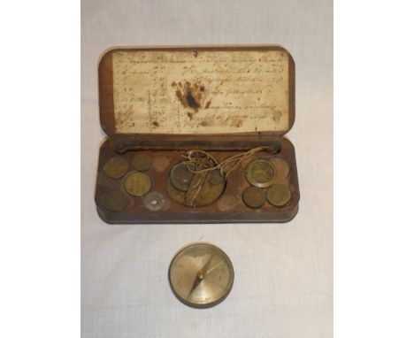 A 19th Century brass and steel travelling scales with various brass weights in stained wood fitted case and a small brass poc