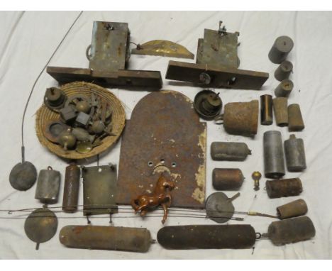 A collection of various longcase clock fittings and parts including two 8-day movements (af), various pendulums, weights etc