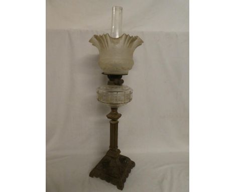 A Victorian cast iron and brass oil lamp with cut glass clear reservoir and etched glass foliate shade (shade in good conditi