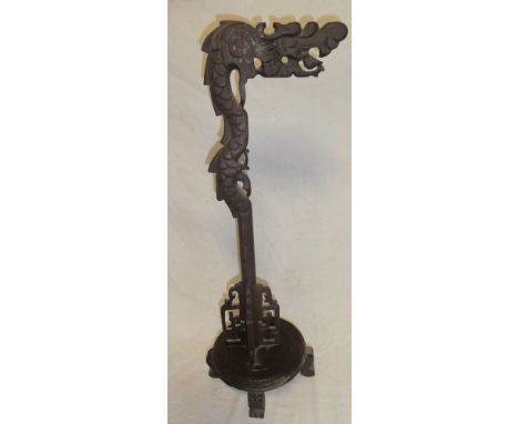 A Chinese rosewood lamp stand with dragon decoration, 28" high