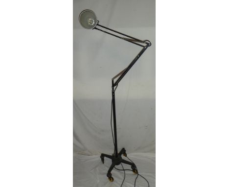 A vintage painted metal full-height angle poise lamp with iron mobile base