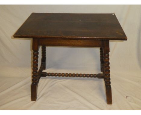 An old oak rectangular occasional table on bobbin turned supports