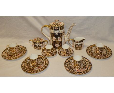 A Royal Crown Derby china coffee set comprising coffee pot, milk jug, lidded sugar basin, six coffee cups, six saucers and fo