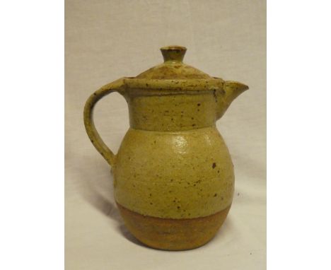 A Leach Studio pottery glazed jug and cover with loop handle, signed "JC" 9" high