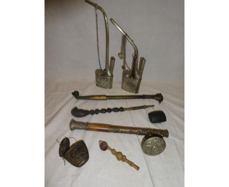 Two various Eastern opium pipes, Eastern brass smokers pipe and various other pipes etc