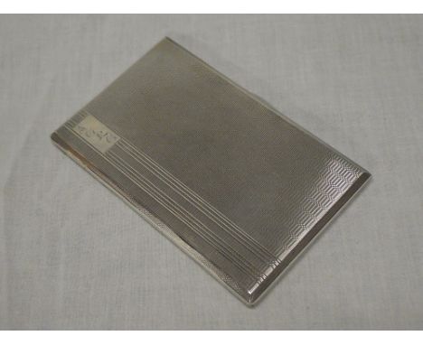 A George VI silver rectangular cigarette case with engine turned decoration, Birmingham marks 1945