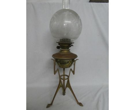 An Edwardian Art Deco-style copper and brass oil lamp with lightning pattern base, detachable reservoir and etched glass shad