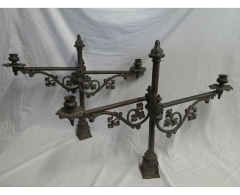 A pair of 19th Century brass ornamental two-branch candelabra with adjustable stems and scroll decoration 20" high