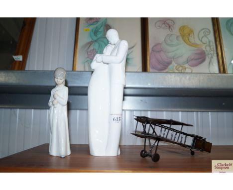 A Royal Doulton figure "Perfect Gift", a Nao figure and a model plane