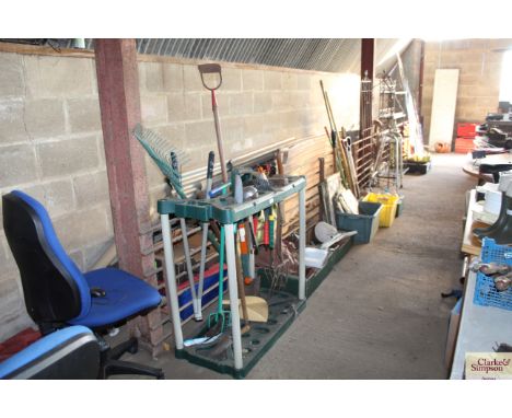A plastic tool stand and large quantity of garden tools 