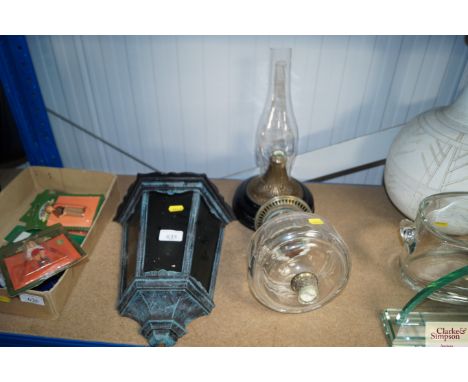 A brass and glass oil lamp (AF), together with an outdoor wall light