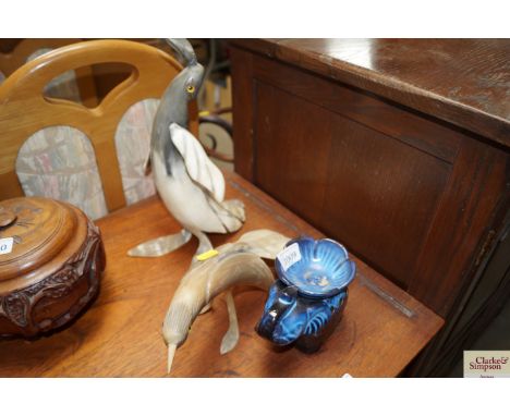 A tea light holder in the form of an elephant together with two horn ornaments depicting birds