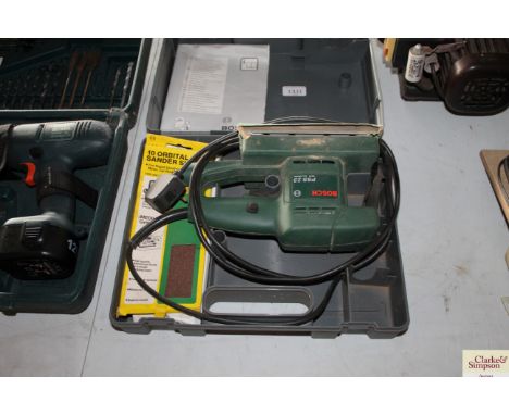 A Bosch orbital sander in case