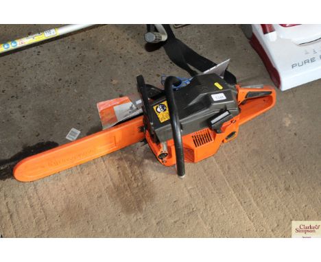 A Husqvarna chain saw with instruction leaflet