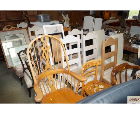 Ten ladder back dining chairs, some painted