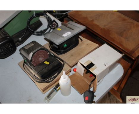 A Minicraft miniature sander; a small miniature table saw etc.