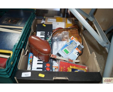 A box of various sundry items to include a tray, miniature keyboard, various DVD's, camera etc.