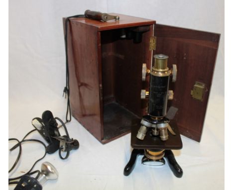 A brass and painted metal monocular (service) microscope by Watson & Sons Limited London in fitted mahogany case