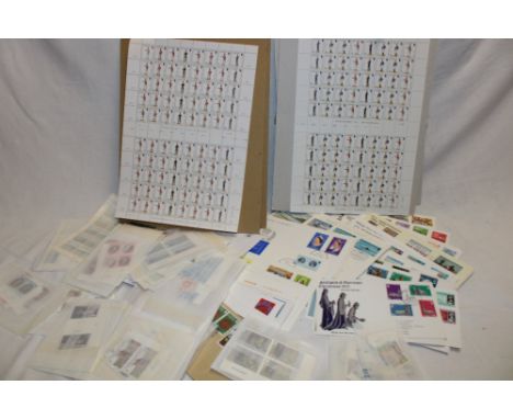 A selection of mint Guernsey stamps including blocks and strips, sheets of mint Guernsey stamps and a selection of Guernsey f