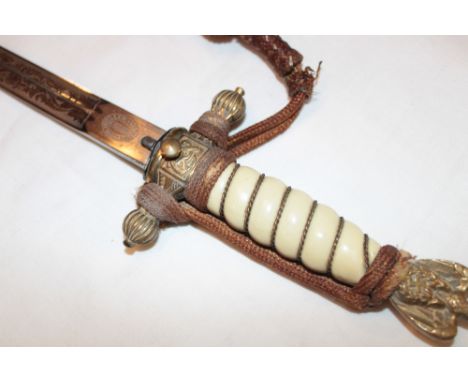 A Second War German Naval Officer's dagger with 10½" blade by FW Holler of Solingen etched with sailing ship and scrolls, bra