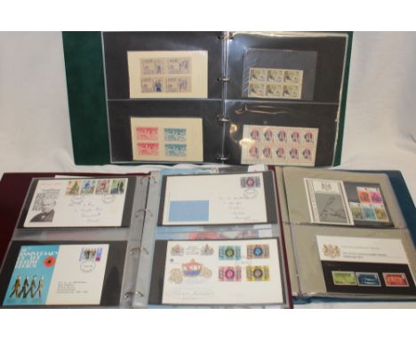 Three albums containing a collection of GB first day covers and stamp presentation packs