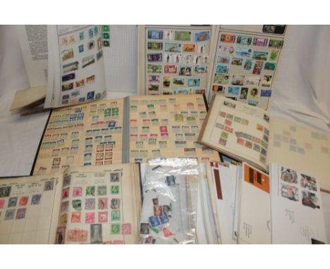 Seven various albums of World stamps, packets of stamps, GB First Day covers etc.