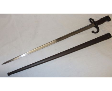 A 19th century French gras bayonet  with triangular single edged blade dated 1878 in steel scabbard