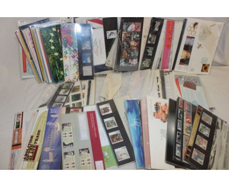 A large selection of various stamp presentation packs, GB first day covers, etc