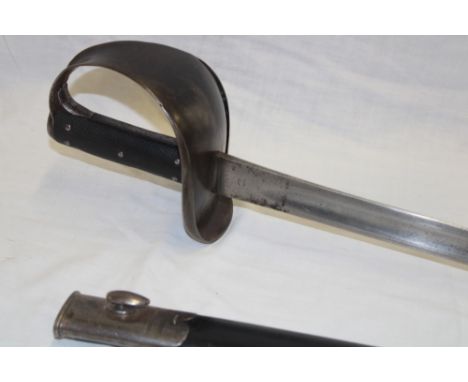 A Victorian 1900 pattern Naval cutlass with 28" steel blade by Wilkinson of London marked "N 5 '02", steel guard with chequer